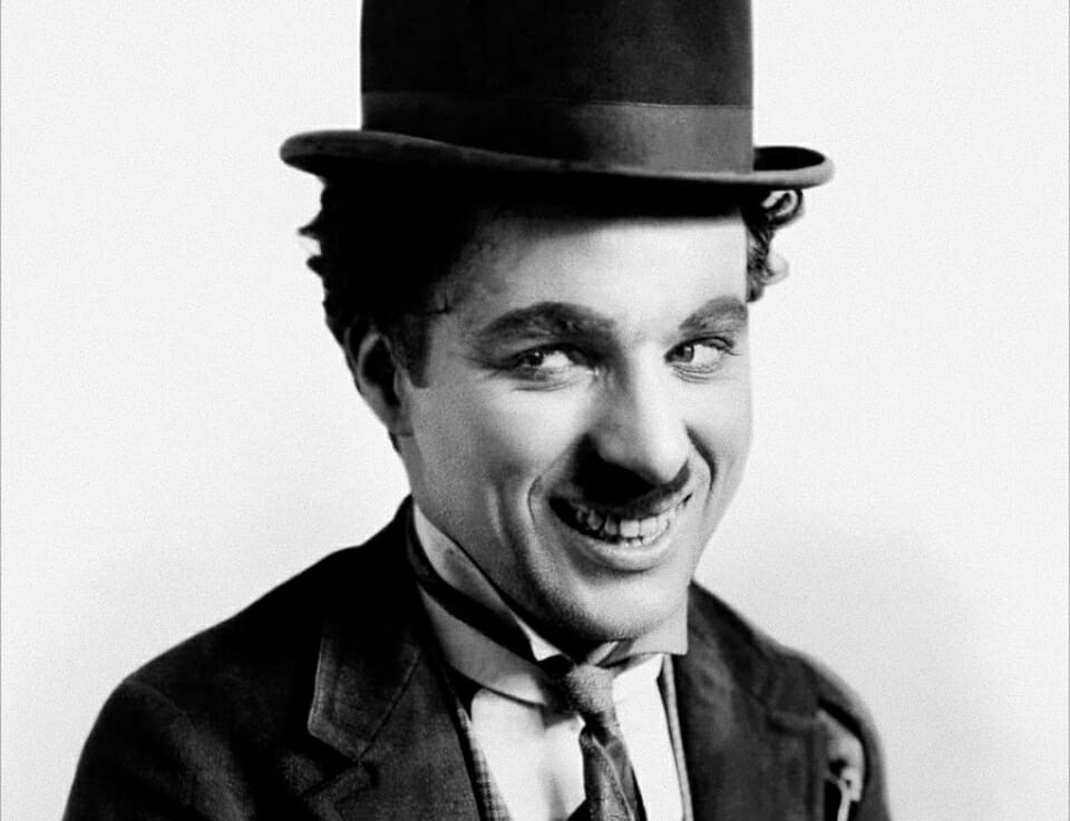 In this image: A headshot of Charlie Chaplin.