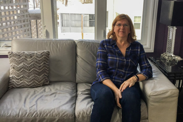 In this image: Donna Lugar sits on a couch.