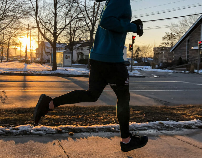 In this image: A person jogging.