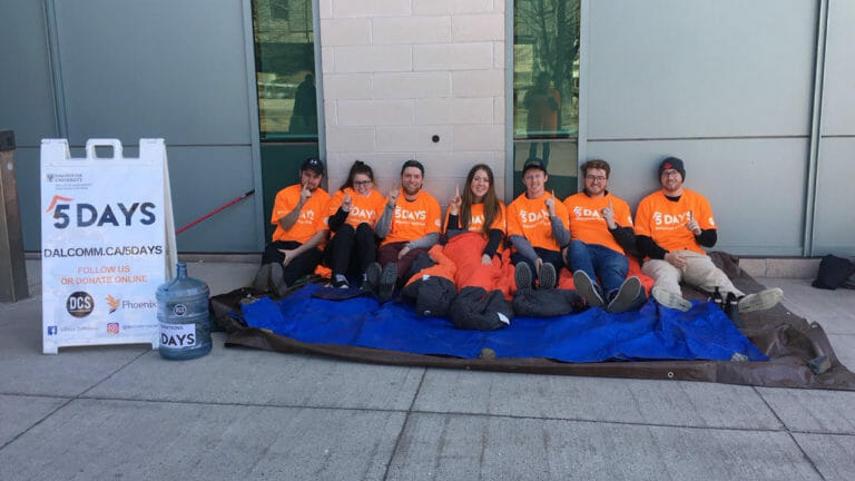 In this image: Dalhousie Commerce Society members sitting outside for 5 Days.