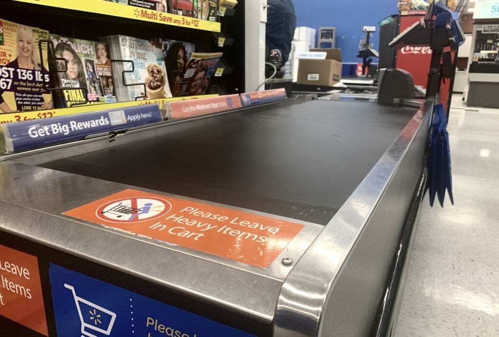 In this image: A grocery store conveyor belt.