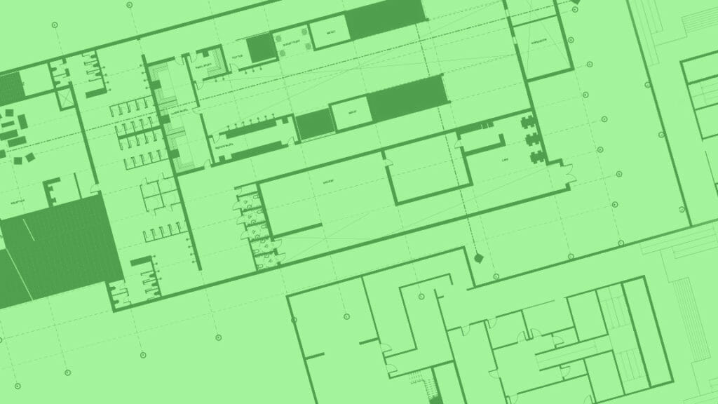 In this image: Green blueprints of a building.