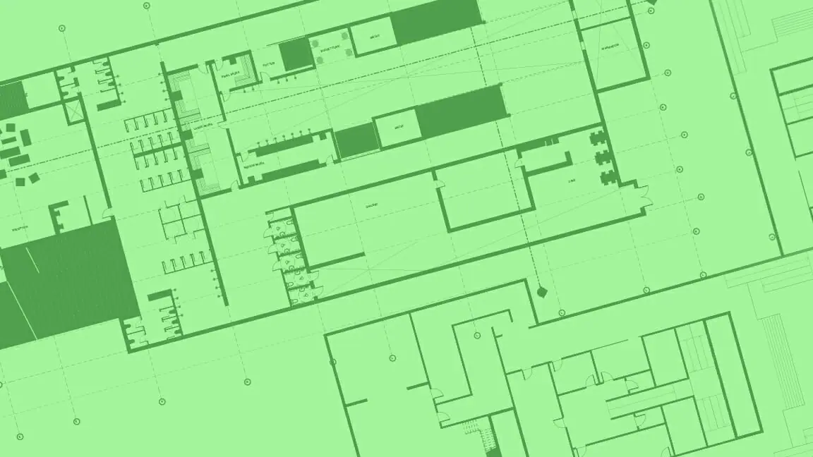In this image: Green blueprints of a building.