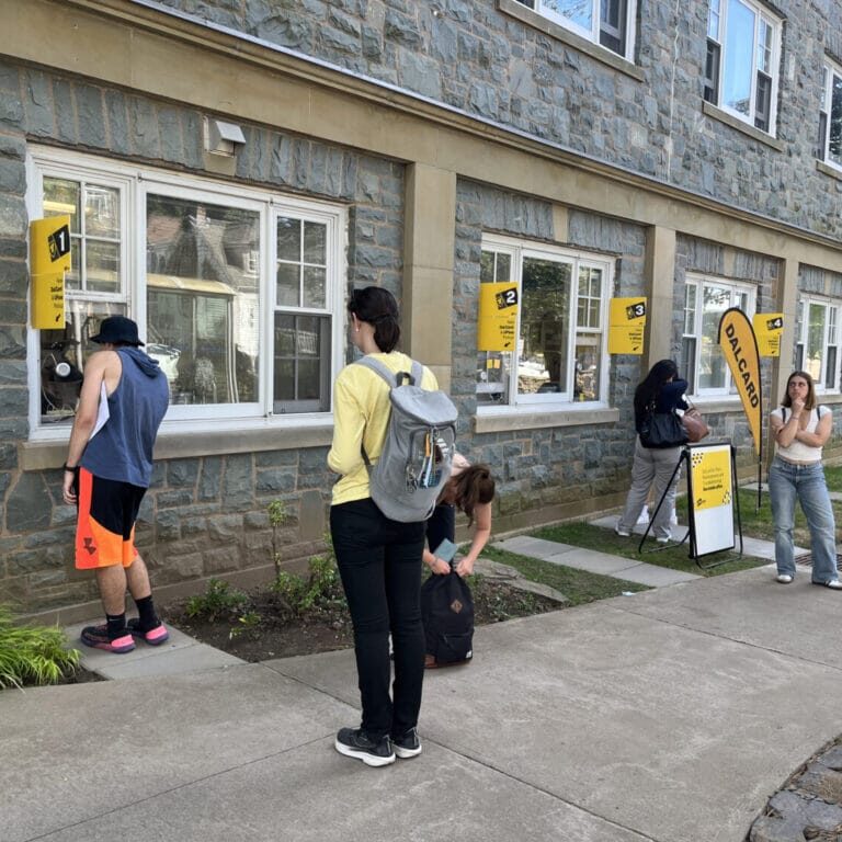 Image by Ainslie Nicholl-Penman Students wait to pick up their UPass stickers that allow them to ride Halifax Transit, including Regional Express services for free (Image by Ainslie Nicholl-Penman)
