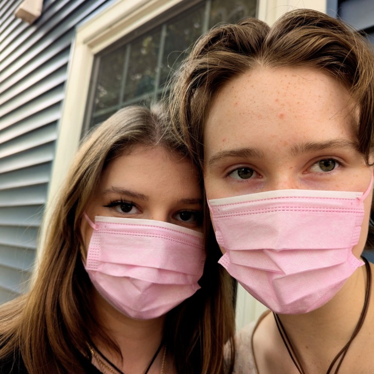 Two people wear face masks while in Halifax, Nova Scotia, on Wednesday, Sept. 24, 2025. (Rachel Bass/Dal Gazette)
