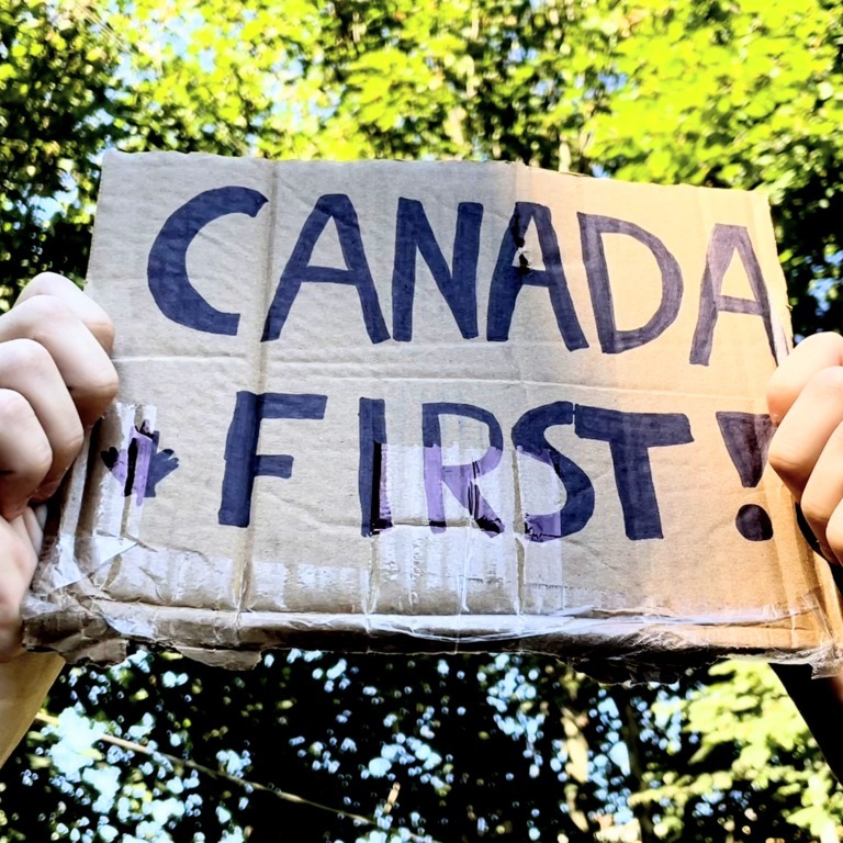 A person holds a “Canada First” sign in Halifax, Nova Scotia, on Wednesday, Sept. 24, 2025. (Celia Fournier/Dal Gazette)
