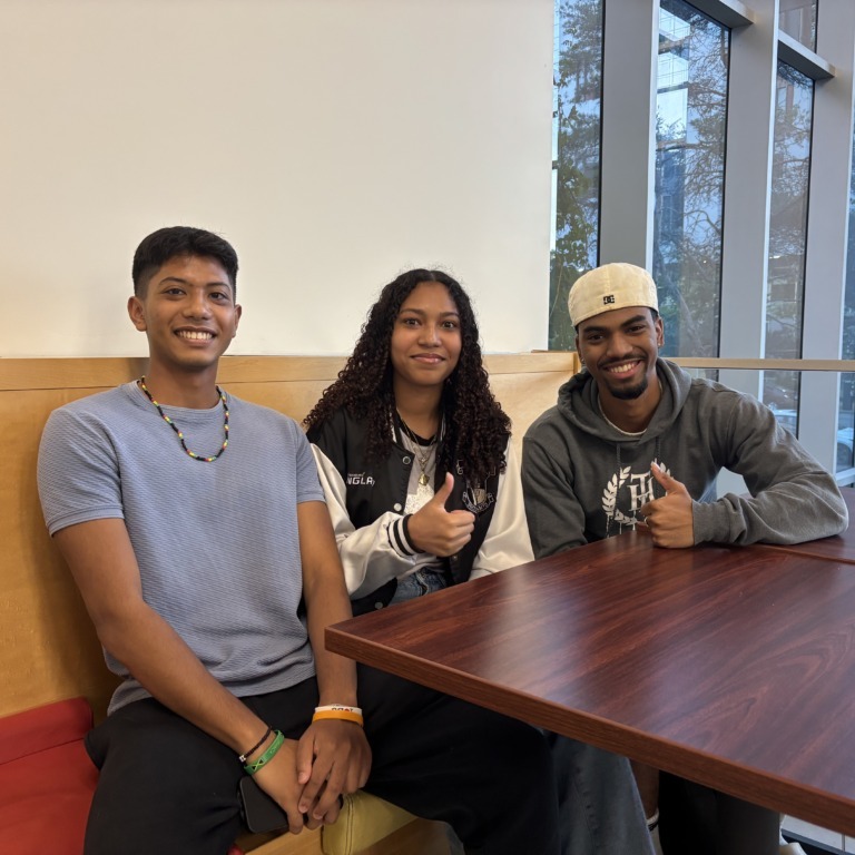 From left: Alexander Chin, Roni Hill, and Andrés Simon-Thompson sit in the Student Union Building in Halifax, Nova Scotia, on Monday, Sept. 29, 2025. They are all members of the Dalhousie Caribbean Connection. (Marielle Godfrey/The Dalhousie Gazette)
