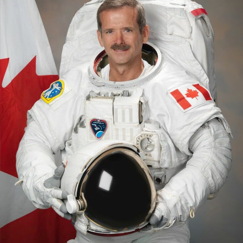 Photograph official portrait of Canadian Astronaut Chris Hadfield in EMU suit.  Photo Date: July 19, 2011.  Location: Building 8, Room 183 - Photo Studio.  Photographer: Robert Markowitz