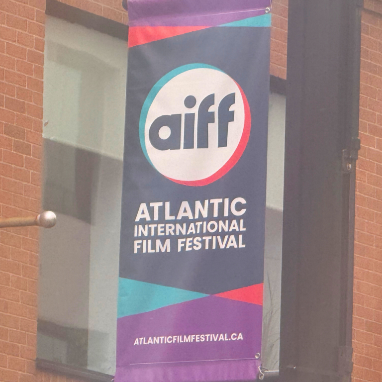 A banner advertising Atlantic International Film Festival on Spring Garden Road, Halifax on August 24. The festival, featuring 116 feature length and short films, will begin on Sept 16. (Jonas May/The Dalhousie Gazette) 
