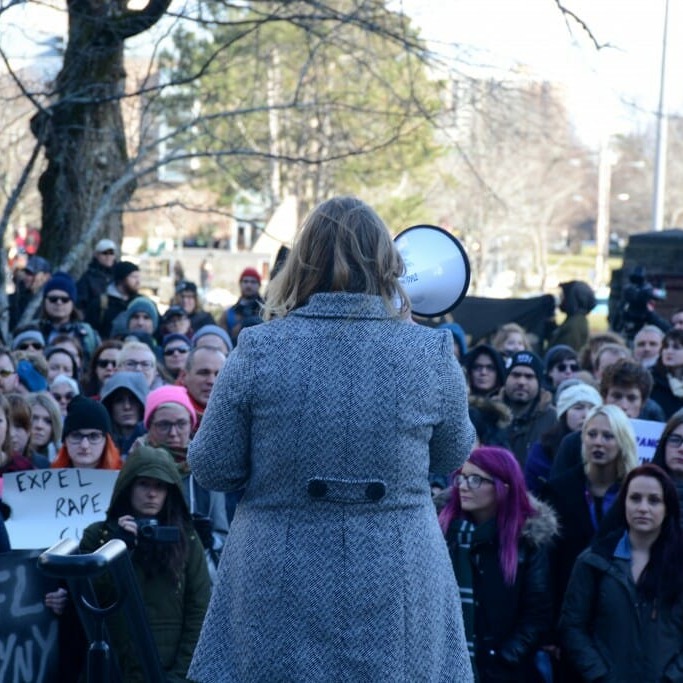 Students protested in front of the Henry Hicks Building in January to address university administration's handling of the Dentistry scandal. 