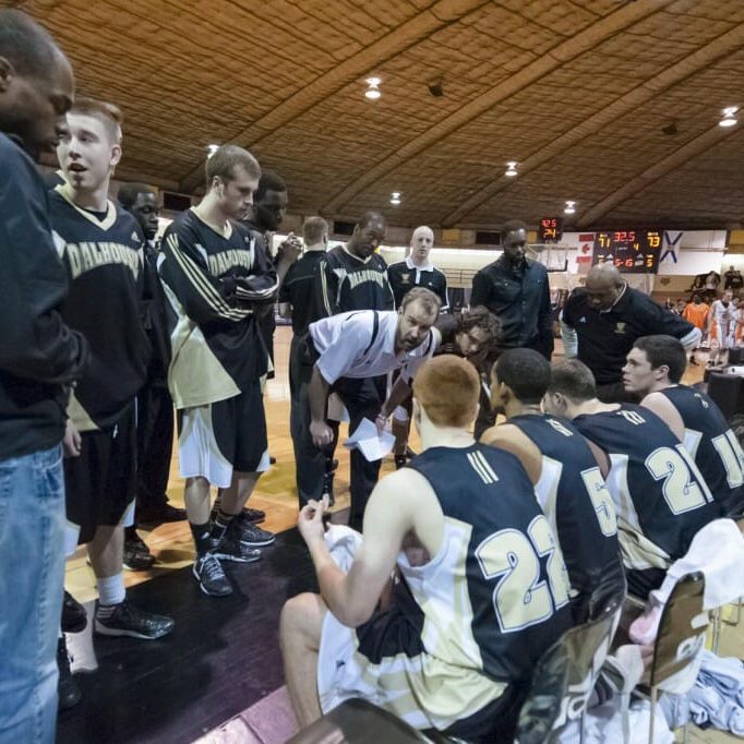 Tigers men's basketball coach John Campbell, in white, is leaving Dalhousie. (Chris Parent photo)