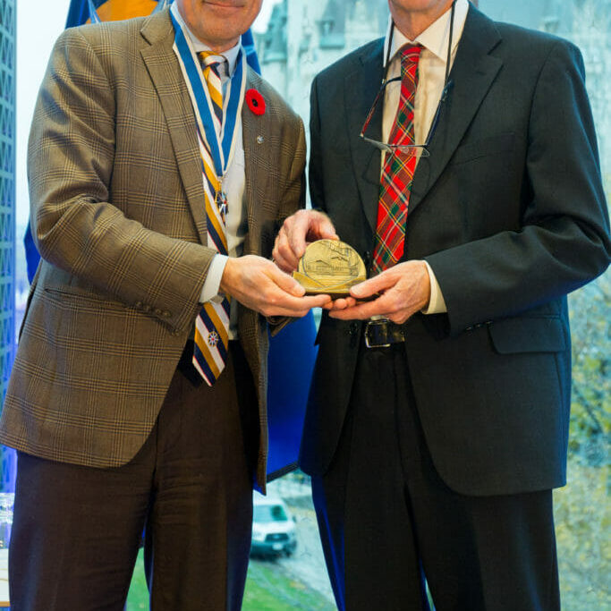Dr. Drummon receives an award.