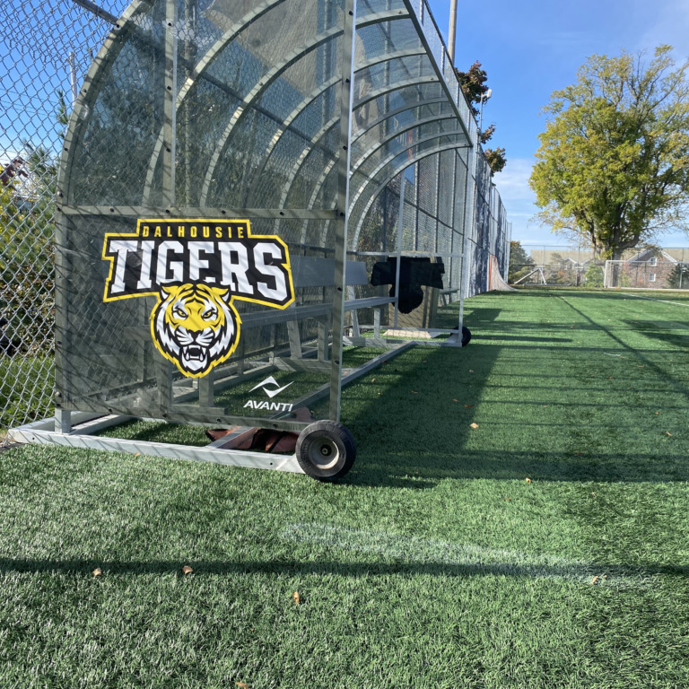 The bench cover at Wickwire Field gleams with a Dalhousie University tigers logo on display on Oct. 14, 2025 in Halifax. (Photo by Ethan Hunt)