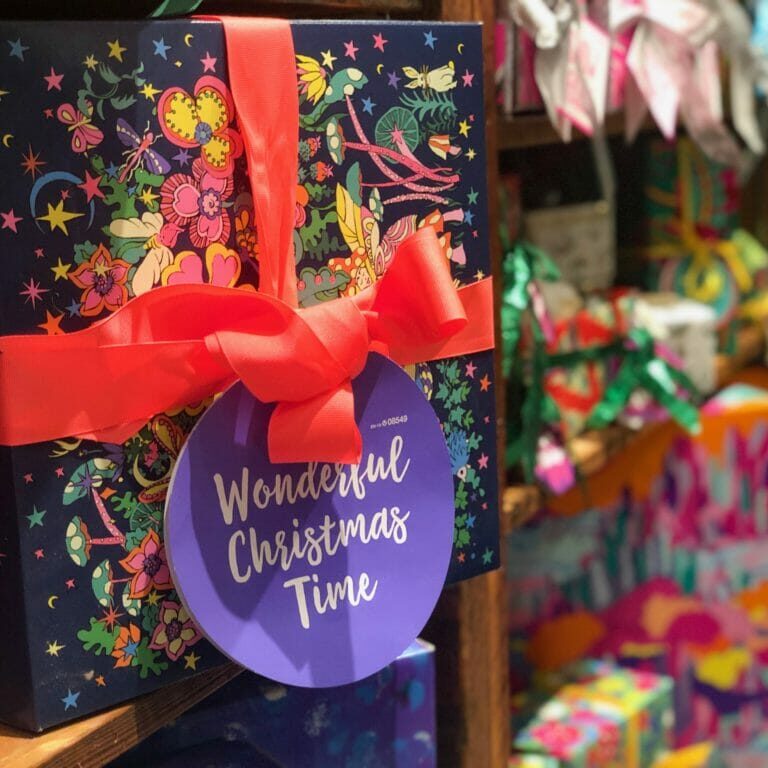 In this image: a wrapped present from LUSH.