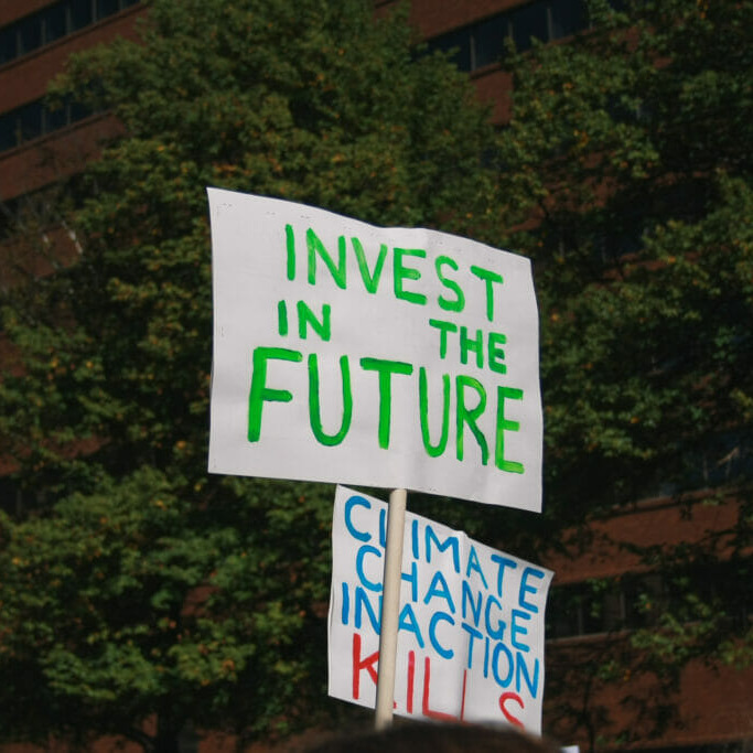Invest in the future (top), Climate inaction kills (bottom). Signs from the Halifax Climate Strike on September 27th 2019. (By Kristen Tymoshuk)