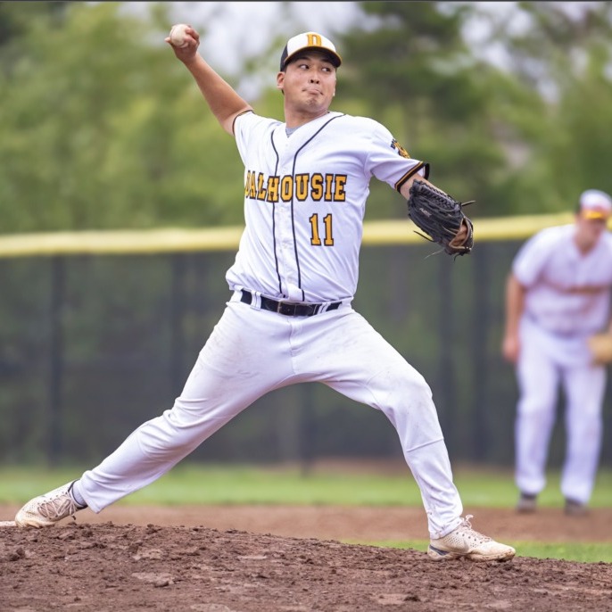 Kieran Song throws a pitch during a baseball game in Halifax, Nova Scotia. (Image courtesy of James Bennet Photography)
