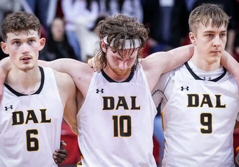 Sam Maillet, a Tiger who will graduate this spring, with his arms around two of his teammates, Malcolm Christie and Caleb Stewart. Image credit: Dal Tigers Photo Gallery