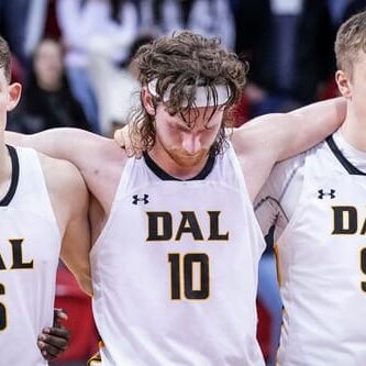 Sam Maillet, a Tiger who will graduate this spring, with his arms around two of his teammates, Malcolm Christie and Caleb Stewart. Image credit: Dal Tigers Photo Gallery