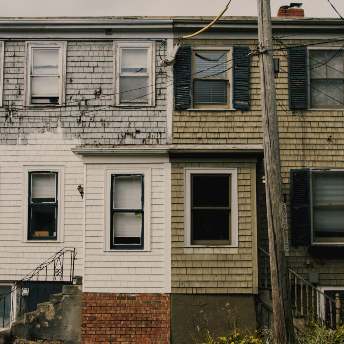 Semi-detached weathered white and taupe homes on Sept. 27, 2026 on West Street in Halifax N.S. 
(Ferris Kerr/The Dalhousie Gazette)