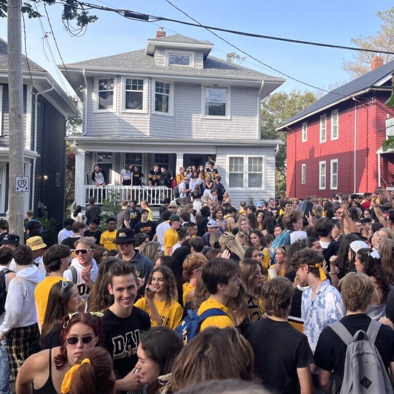 Students gather on Jennings Street to celebrate Dalhousie homecoming in Halifax, N.S., on Sunday, Oct. 1, 2023. (Jenna Olsen/The Dalhousie Gazette)