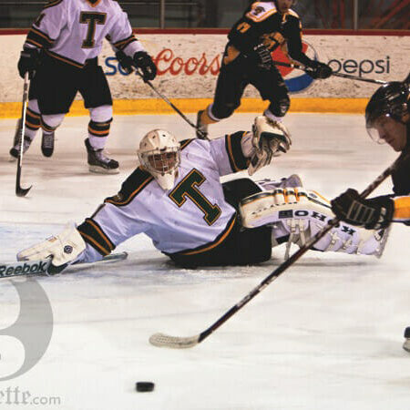 Brendon MacDonald tries to get a shot past St Thomas goalie, Charles Lavigne. Photo by Martina Marien