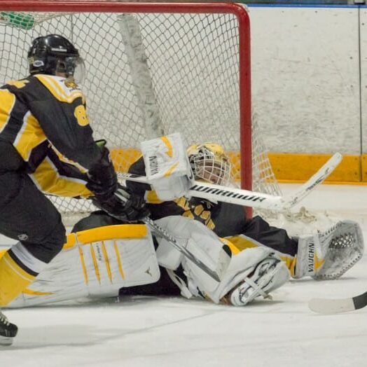 Tigers keeper Bobby Nadeau makes a desperation save against St. Thomas Jan. 25. (David Munro photo) Tigers keeper Bobby Nadeau makes a desperation save against St. Thomas Jan. 25. (David Munro photo)