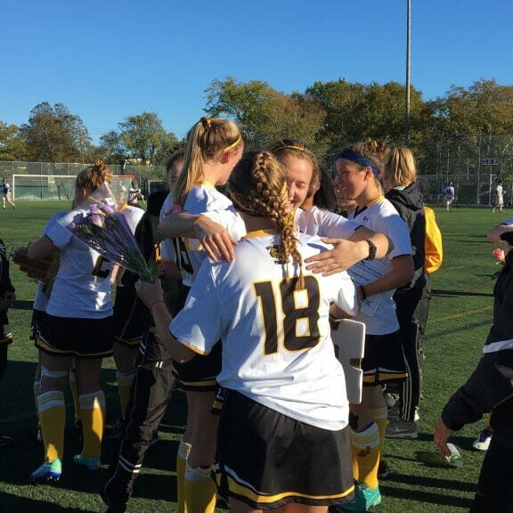 IMG_0257 The team celebrates after beating UPEI 1-0 to capture their fourth straight Atlantic University Field Hockey Championship.