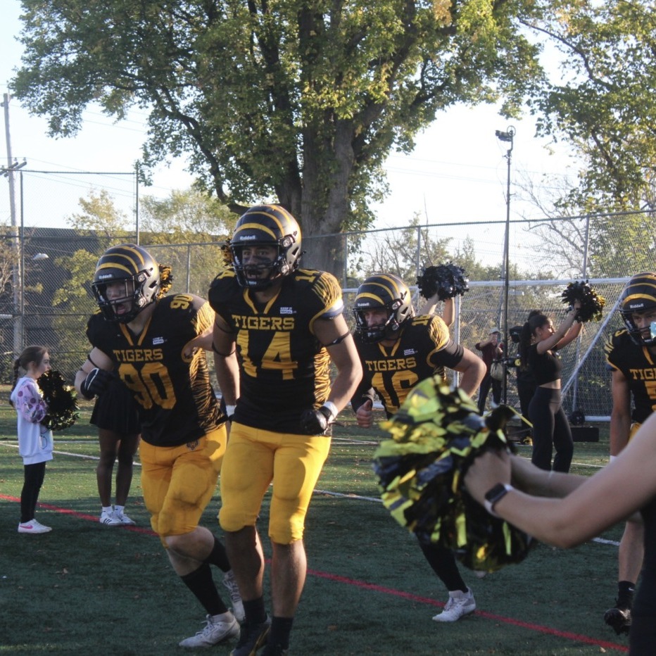 Dalhousie University football club runs onto the field after halftime at Dal’s homecoming game at Wickwire Field in Halifax, NS. The Tigers lost the game 24-21 to the University of New Brunswick. (Photo by Ethan Hunt)