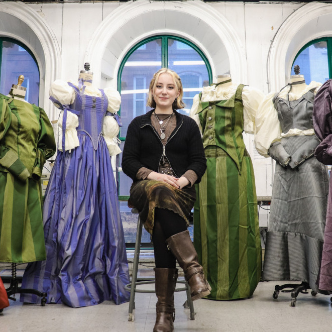 Emily Buckland poses with her designs at NSCAD (Rachel Bass/The Dalhousie Gazette