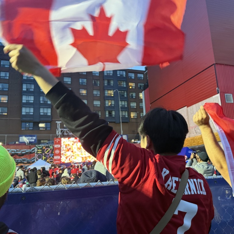 Ethan Tam celebrates Canada's sixth goal against Qatar on June 18 outside of the Canada Soccer House showing of the game at the Grafton Street Beer Garden in Halifax. (Jonas May/The Dalhousie Gazette)  