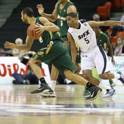 Basketball - CIS Alberta's Daniel Ferguson goes for the run. He had a game-high 31 points.