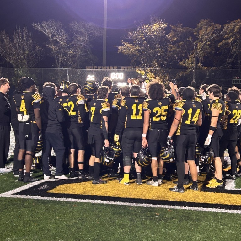 The Dalhousie University football club hoists their trophy at Wickwire Field in Halifax, Nova Scotia on Nov. 1, 2025 following their victory in the Atlantic Football League championship game. (Dylan Buckman/Dalhousie Gazette)