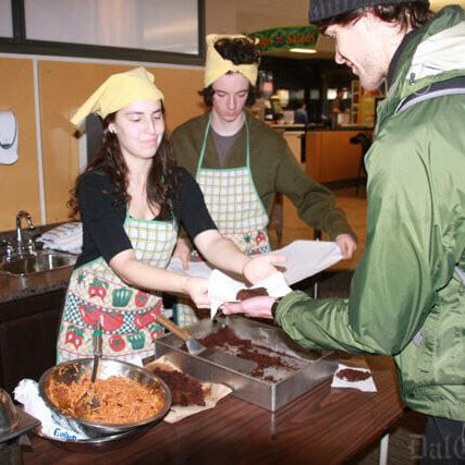 Rebecca Hoffer serves up vegan brownies at a tuesday serving. Photo by Katrina Pyne
