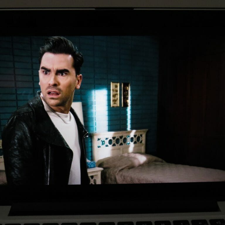 ImportanceofDavidRose2_GraceMasonParkinson In this image: Dan Levy on-screen in a still shot of Schitt's Creek playing on a laptop.