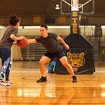 Two Dalhousie University students play a game of intramural basketball at the Dalplex in Halifax, NS. Photo by Dalhousie University.