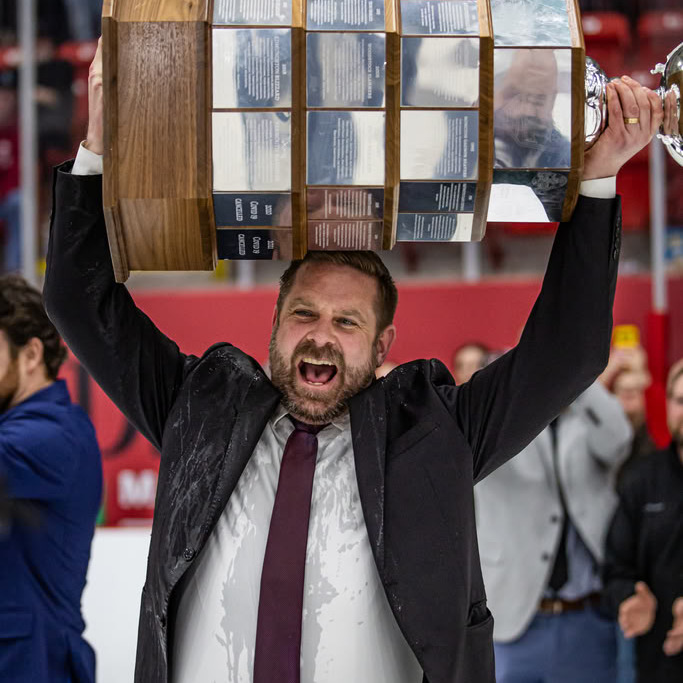 Jon Greenwood hoists the Metalfab MHL Cup on April 27, 2026. (Image courtesy of Zachary Boone)