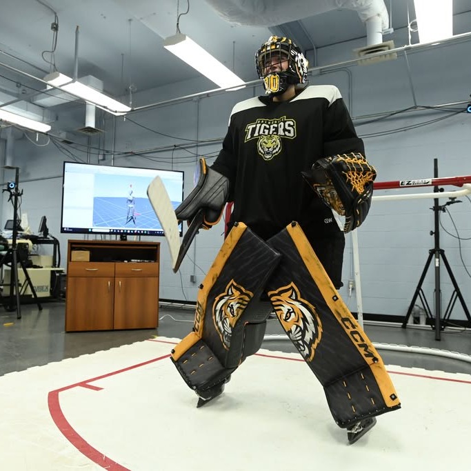 Madison King tests out motion-tracking technology on synthetic ice in the Biomechanics, Ergonomics and Neuroscience (BEN) Lab at Dalhousie University in Halifax. (Image courtesy of Cody Turner and Daniel Abriel)
