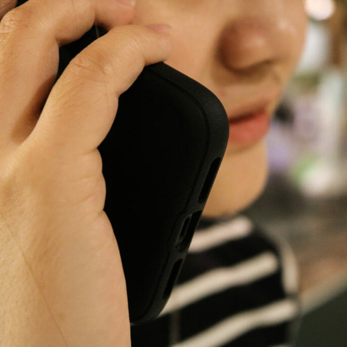 In this image: A photo illustration of a woman talking on a cellphone.
