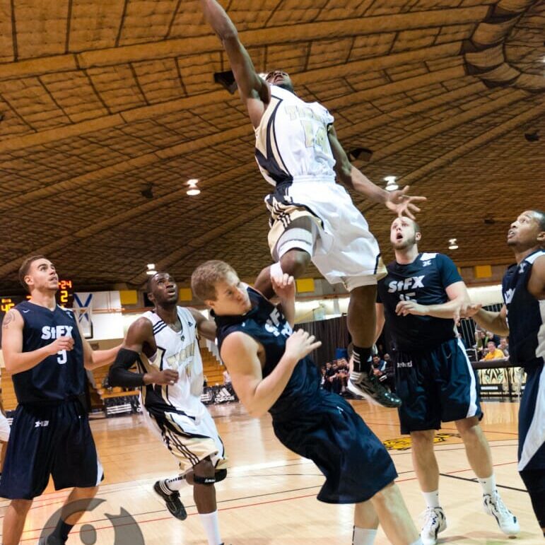 Kashrell Lawrence goes airborne in an authoritative Tigers victory. (Chris Parent photo)