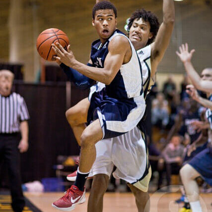 Mens basketball The X-Men could not contend with Robert Nortmann and the surging Tigers. Photo by Pau Balite