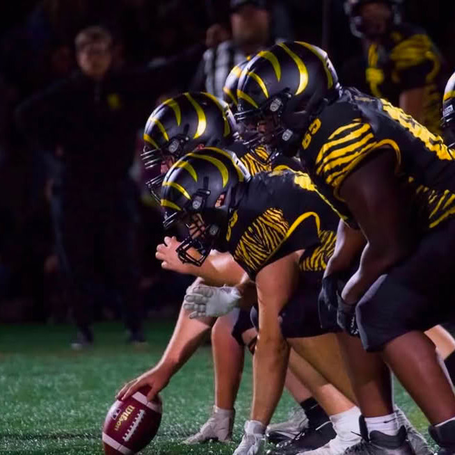 Dalhousie University Football players at the line of scrimmage in Halifax N.S. (Image courtesy of Mark Kays)
