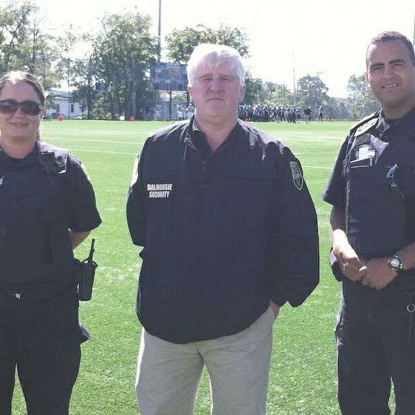 Mike Burns (centre), director of security, and Dalhousie security officers at Wickwire Field. Photo by Kristie-Lynn Smith.