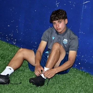 Mo Tolba sits on a soccer field in Halifax, Nova Scotia, during a break from training. (John MacNeil/PNI Atlantic) July 17, 2024
