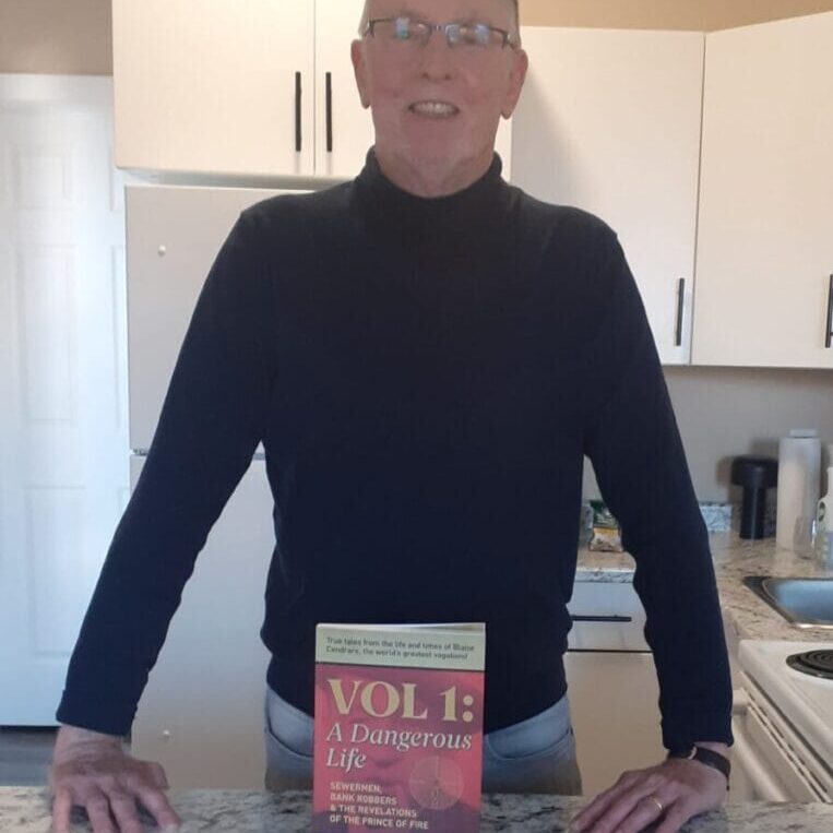 David MacKinnon poses with his latest work, an English translation of essays by French-Swiss writer Blaise Cendrars. (Image credit: David MacKinnon)