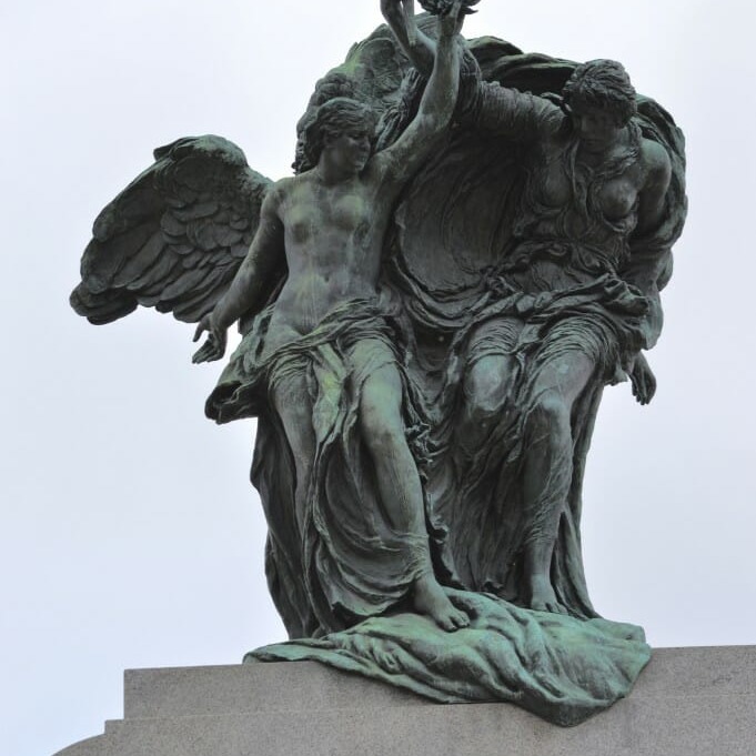 Two allegorical statues of freedom standing atop the National War Memorial. (photo by Kienan Webb)