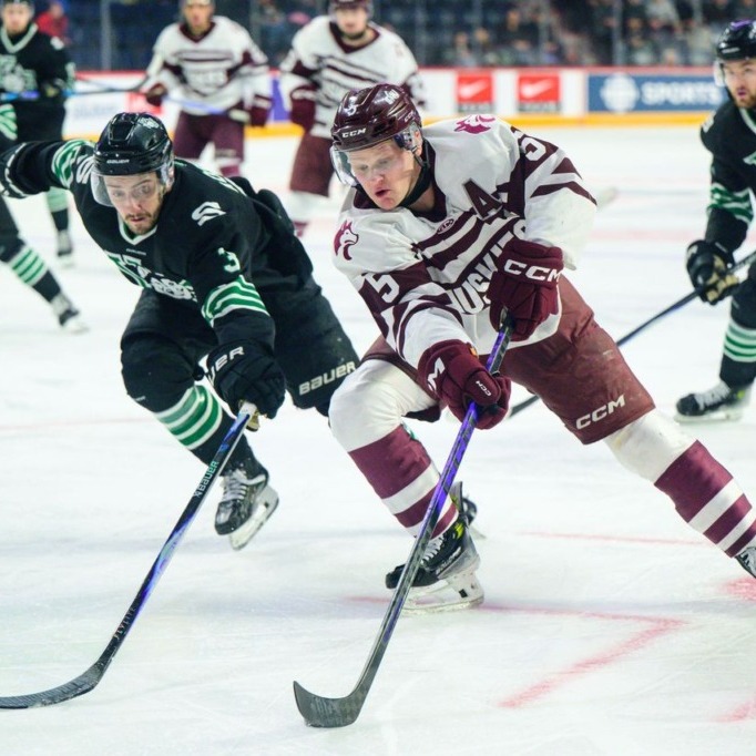 Saint Mary's University's men's hockey forward Reid Valade drives the net against University of Saskatchewan's defender Ben Saunderson on March 19, 2026 at the Scotiabank Centre. (Image courtesy of Saint Mary's Huskies Athletics)