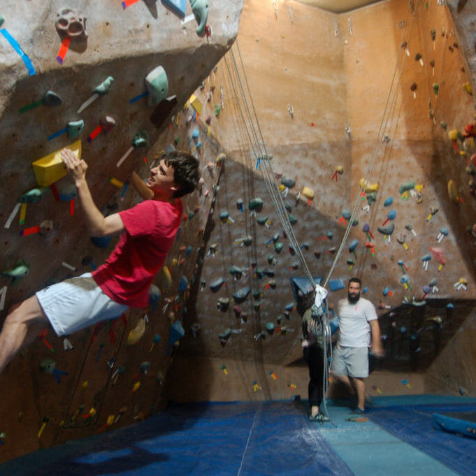 In this image: James Wise climbs a bouldering wall at the Dalplex.