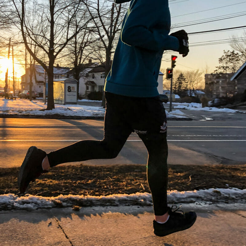 In this image: A person jogging.
