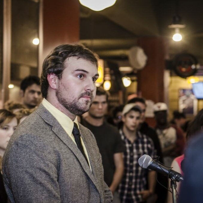 SMUSA president Jared Perry addresses the press on September 5 before stepping down the next day. He participated in the chant.