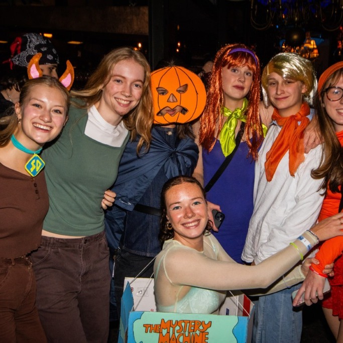 Attendees pose in Scooby-Doo inspired outfits during an event at the Marquee Ballroom in Halifax, Nova Scotia on Oct. 25, 2025. (Lukas Kohler/Dalhousie Gazette)